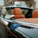 Close up of luxury cabriolet convertible car with orange leather interior