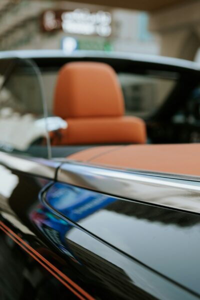 Close up of luxury cabriolet convertible car with orange leather interior