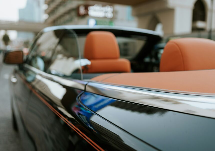 Close up of luxury cabriolet convertible car with orange leather interior