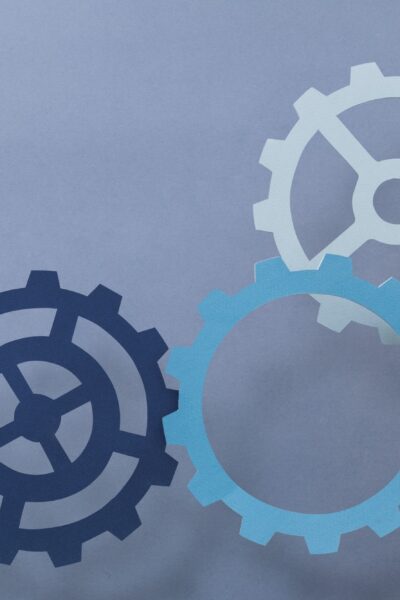 Cogwheel business productivity symbol held by hands