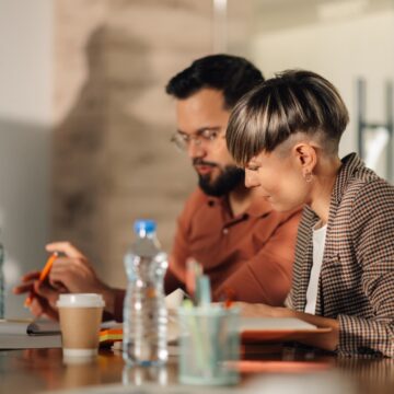 Colleagues working together on a project in modern office