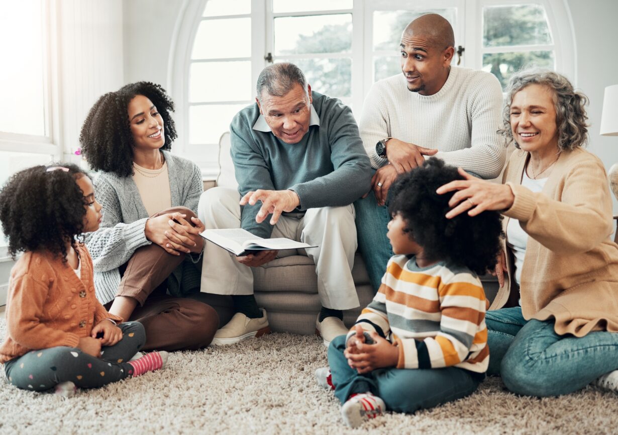 Family relax, generations with fantasy and reading book, grandparents with parents and kids at home