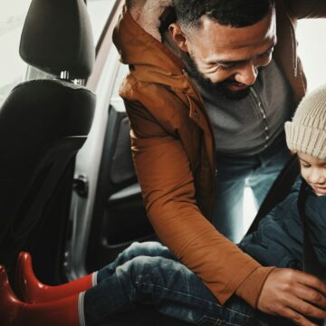 Father, help or child with seat belt for safety traveling on vacation, road trip or holiday in car