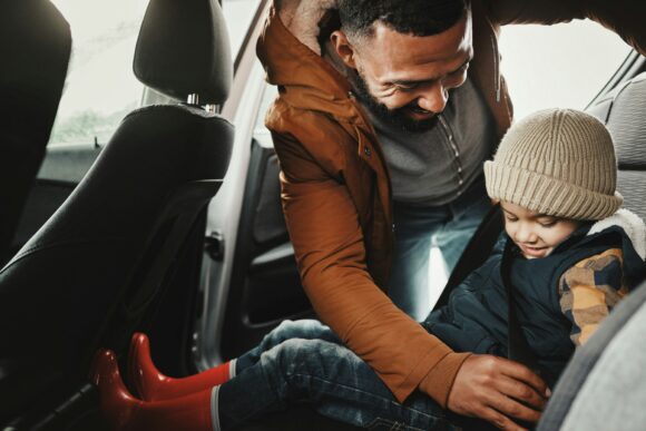 Father, help or child with seat belt for safety traveling on vacation, road trip or holiday in car