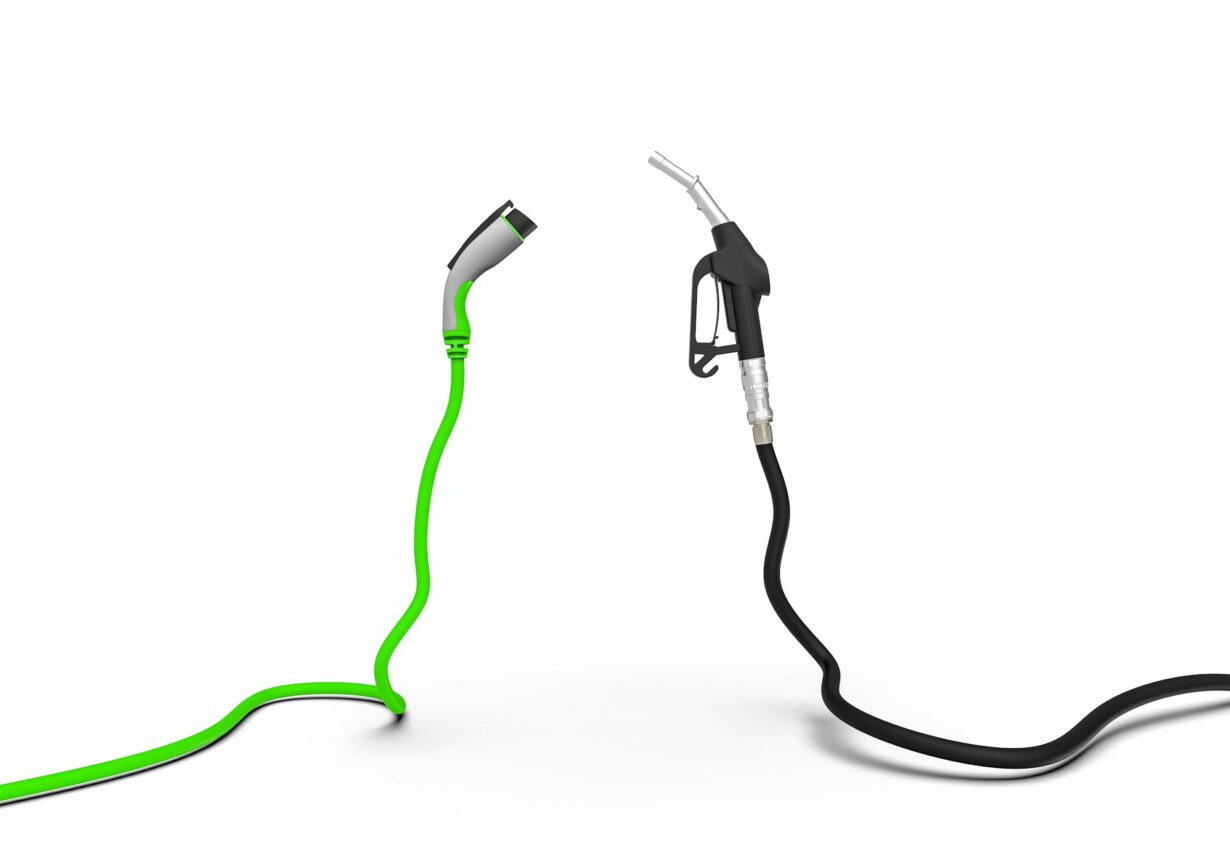 Gas nozzle vs electric vehicle charging plug