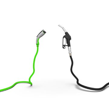 Gas nozzle vs electric vehicle charging plug