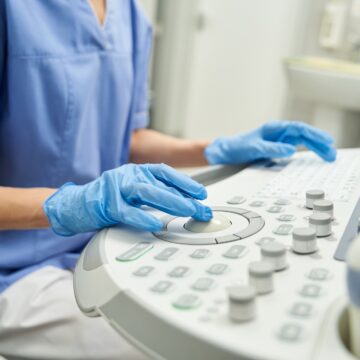 Gynecologist performing diagnostics in modern healthcare clinic setting