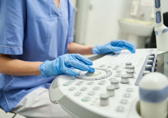 Gynecologist performing diagnostics in modern healthcare clinic setting