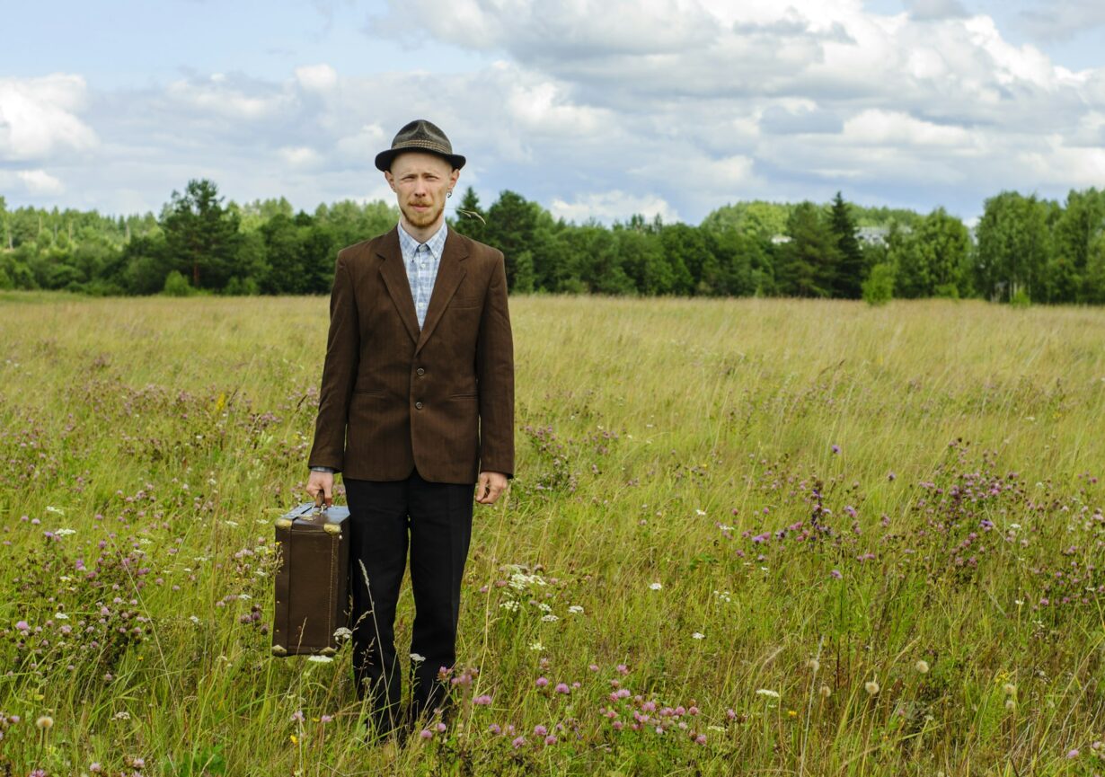 Man in vintage clothes in country