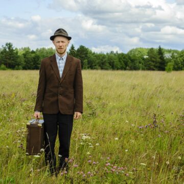 Man in vintage clothes in country