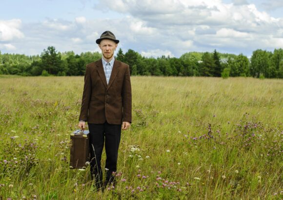 Man in vintage clothes in country